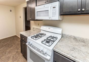 Kitchen with a stove and microwave